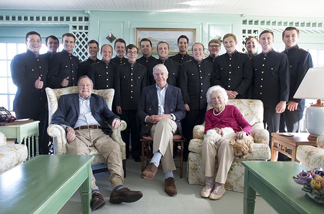 Singing cadets pose with Bush family and John Major