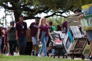 Students move containers into dorms 