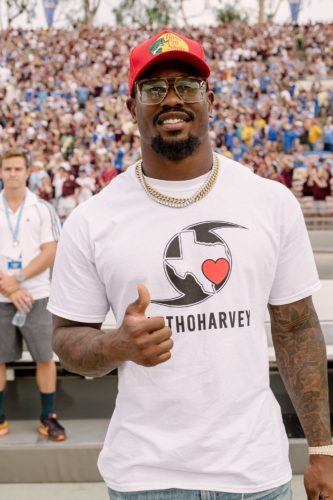 Former Aggie linebacker Von Miller wore a #BTHOHarvey t-shirt on the sidelines at the Texas A&M vs. UCLA football game Sunday night.