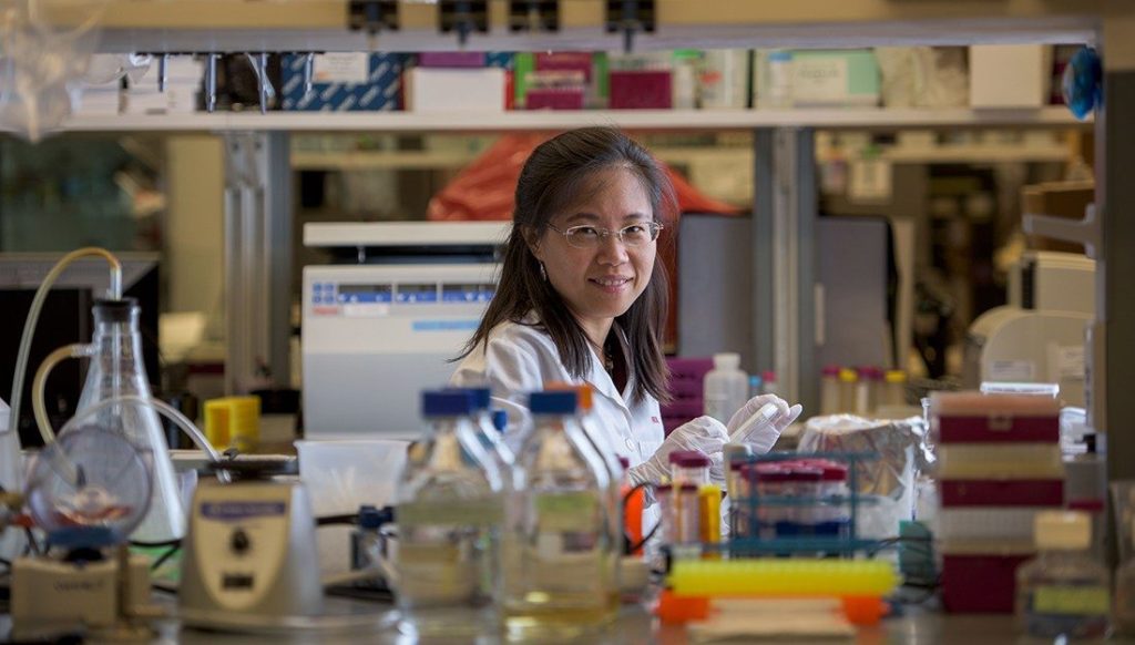 Researcher smiling in lab
