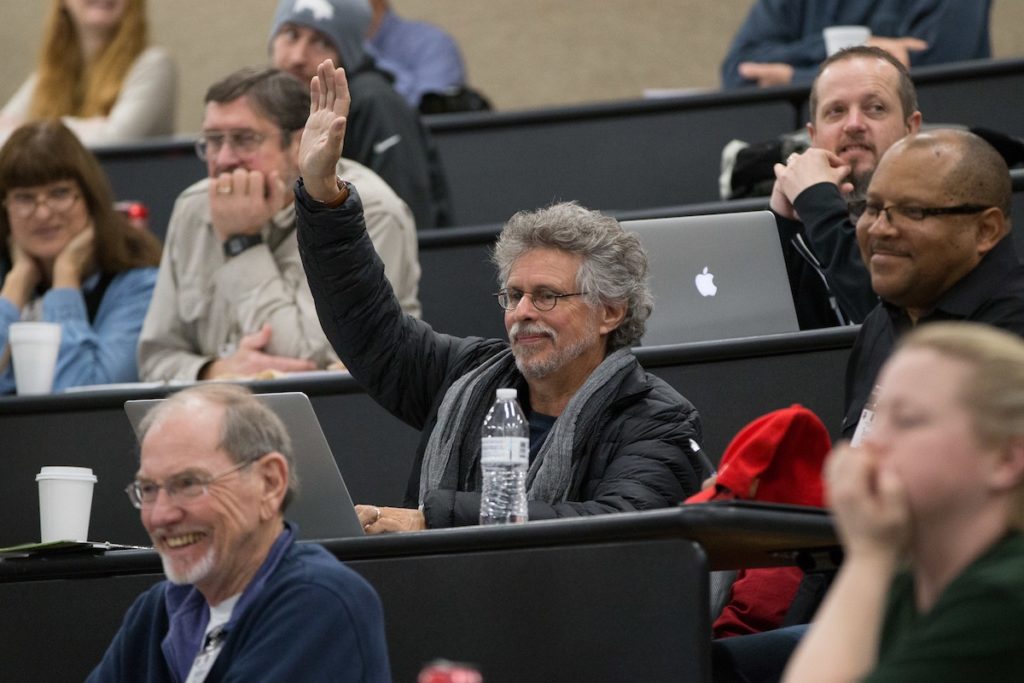 Barbecue Bible author Steven Raichlen (center) was one of the faces in the crowd at Camp Brisket.