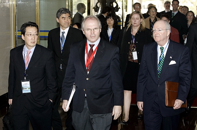 U.S. Assistant Secretary of State Christopher Hill (C) arrives with U.S. Ambassador to China Clark Randt (R) and Victor Cha (L) the U.S. National Security Council's director for Asian Affairs to the opening of negotiations from six countries on the denuclearization working group talks in Beijing's Diaoyutai State Guesthouse March 17, 2007 in Beijing, China. North Korea's top envoy said separately Saturday that the North will not stop its nuclear activity unless $25 million of its funds held in a Macau bank are fully released. (Photo by Greg Baker-Pool/Getty Images)
