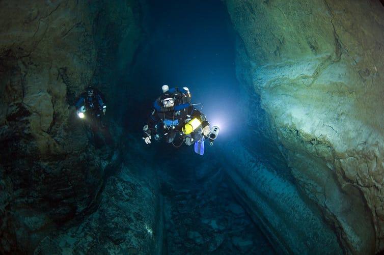 Tom Iliffe diving with his Megalodon closed-circuit rebreather in a lava tube cave in the Canary Islands.