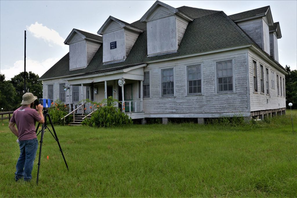 Ben Baaske prepares to scan the Wheelock Schoolhouse.