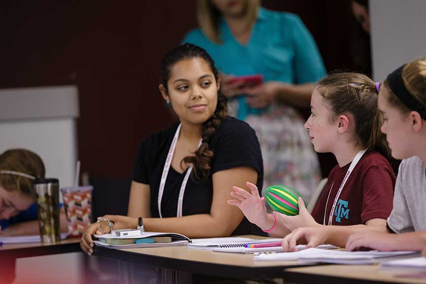 a P4C staff member works with middle schoolers