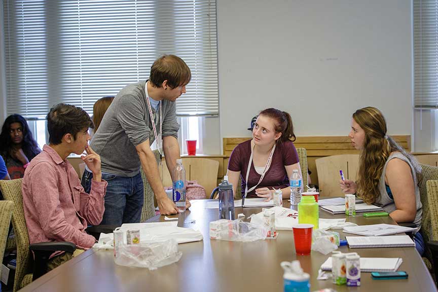 a doctoral student works with high school campers during P4C
