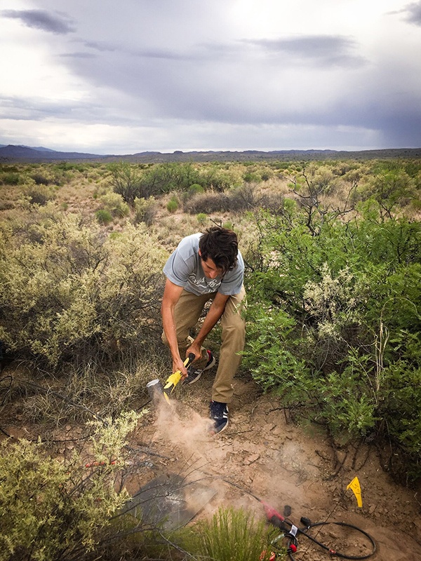 Acevedo conducting field work.