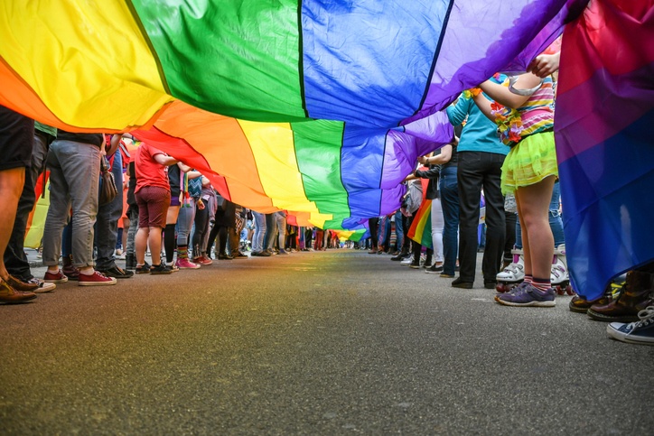 Under a LGBT Pride Flag (Getty Images)