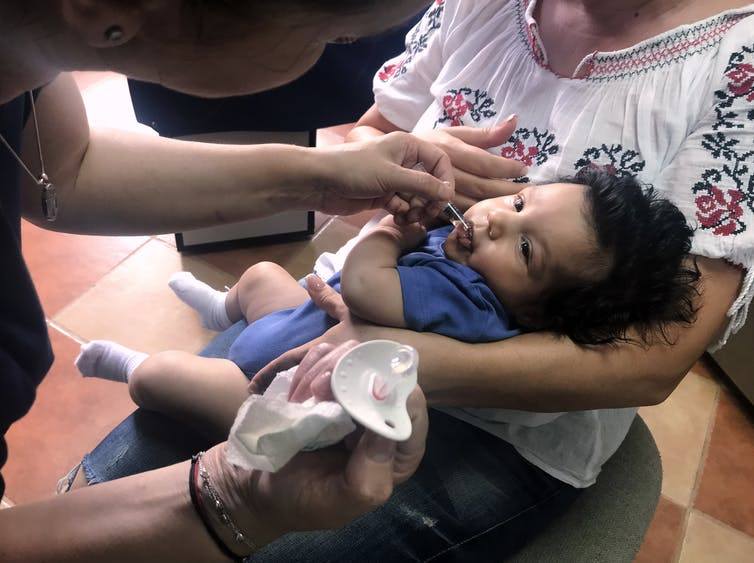 A child in Romania, on June 6, 2018, receives vaccination after a measles outbreak has sickened hundreds of children. Health officials say the outbreak is serious because of low vaccination rates. (Olimpiu Gheorghiu/AP Photos)