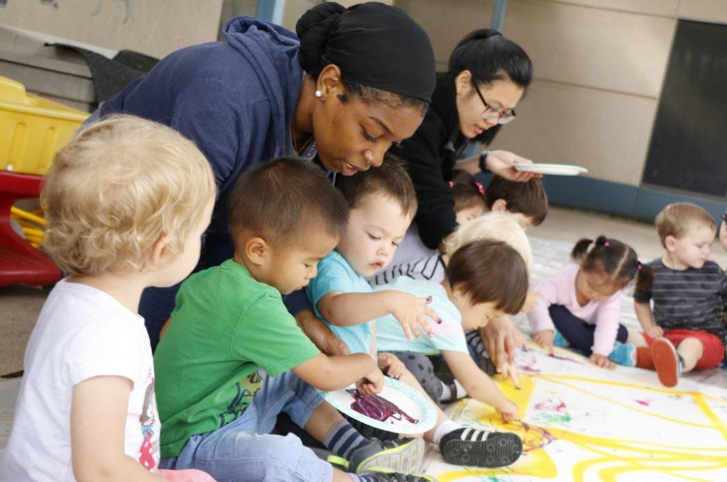 Children at the Becky Gates Children's Center take part in finger painting activities. (Texas A&M Student Affairs)