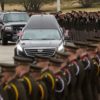 cadets in front of a hearse
